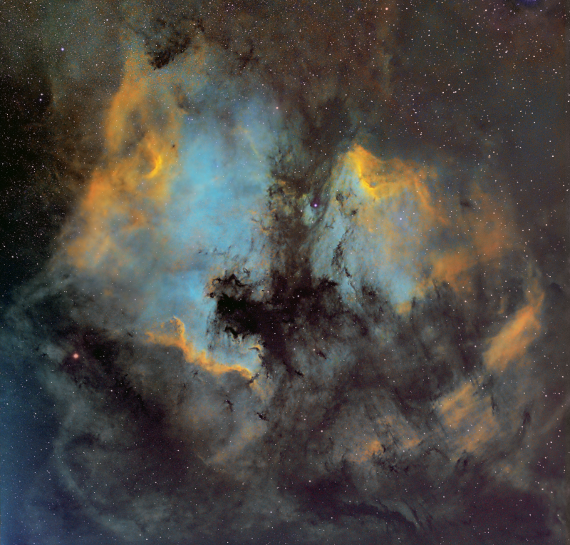 NAN and Pelican with Samyang lens 
Originally imaged in 2020 during the Panemic, now with improved processing.
Samyang 135mm F2.8
Atik 460EX
HEQ5
Ha 16 x 600
Oiii 2 x 300 binned x 2 (clouds spoiled the other 6)
Sii 6x 300 binned x 2
RGB for stars 8 a 150 each
Total imaging time 4 hours 20mins
Link-words: Carole