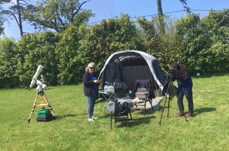 Sue and Roy wuth their Tent and kit.  Roy looking through the solarscope, 
Link-words: Campsites2024
