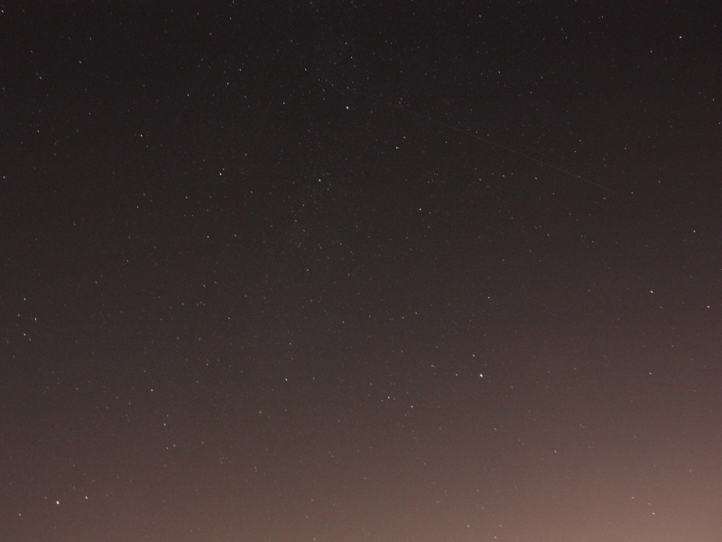 Cygnus and Lyra
Cygnus and Lyra were sinking down towards the horizon in the West. Even from the recreation ground at Otford, with London hidden by the North Downs, the light pollution is overpowering in the photo. A satellite also snuck into the shot. :)
