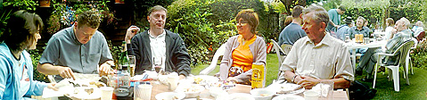 Members round the table at the barbecue